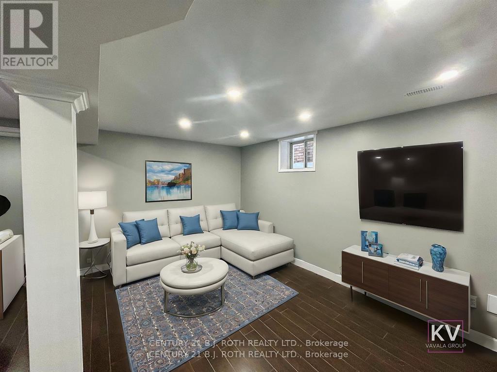 Virtually Staged Living Room - Lower - 140 Monique Crescent, Barrie, ON - Indoor Photo Showing Basement