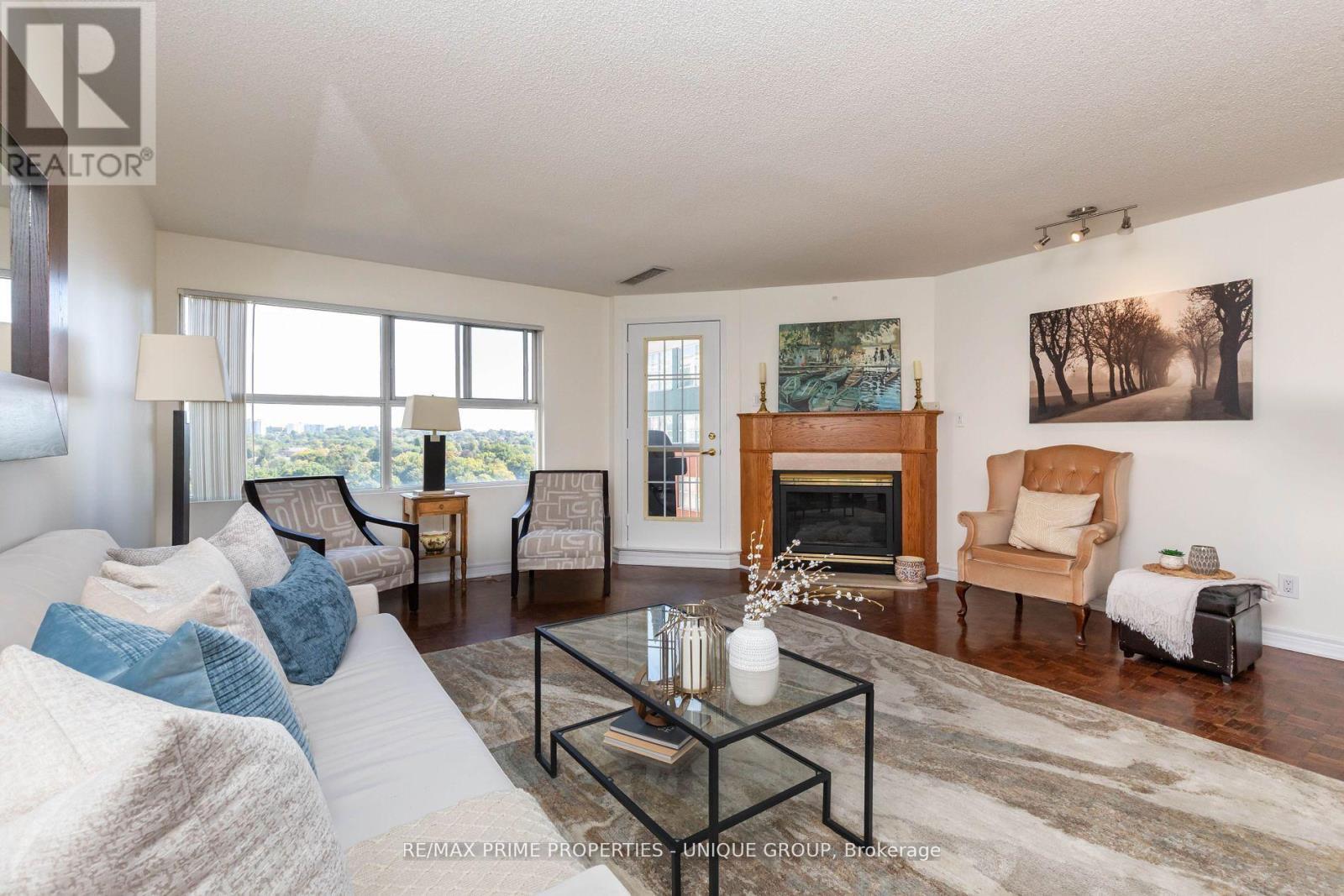 808 - 18 Concorde Place, Toronto, ON - Indoor Photo Showing Living Room With Fireplace