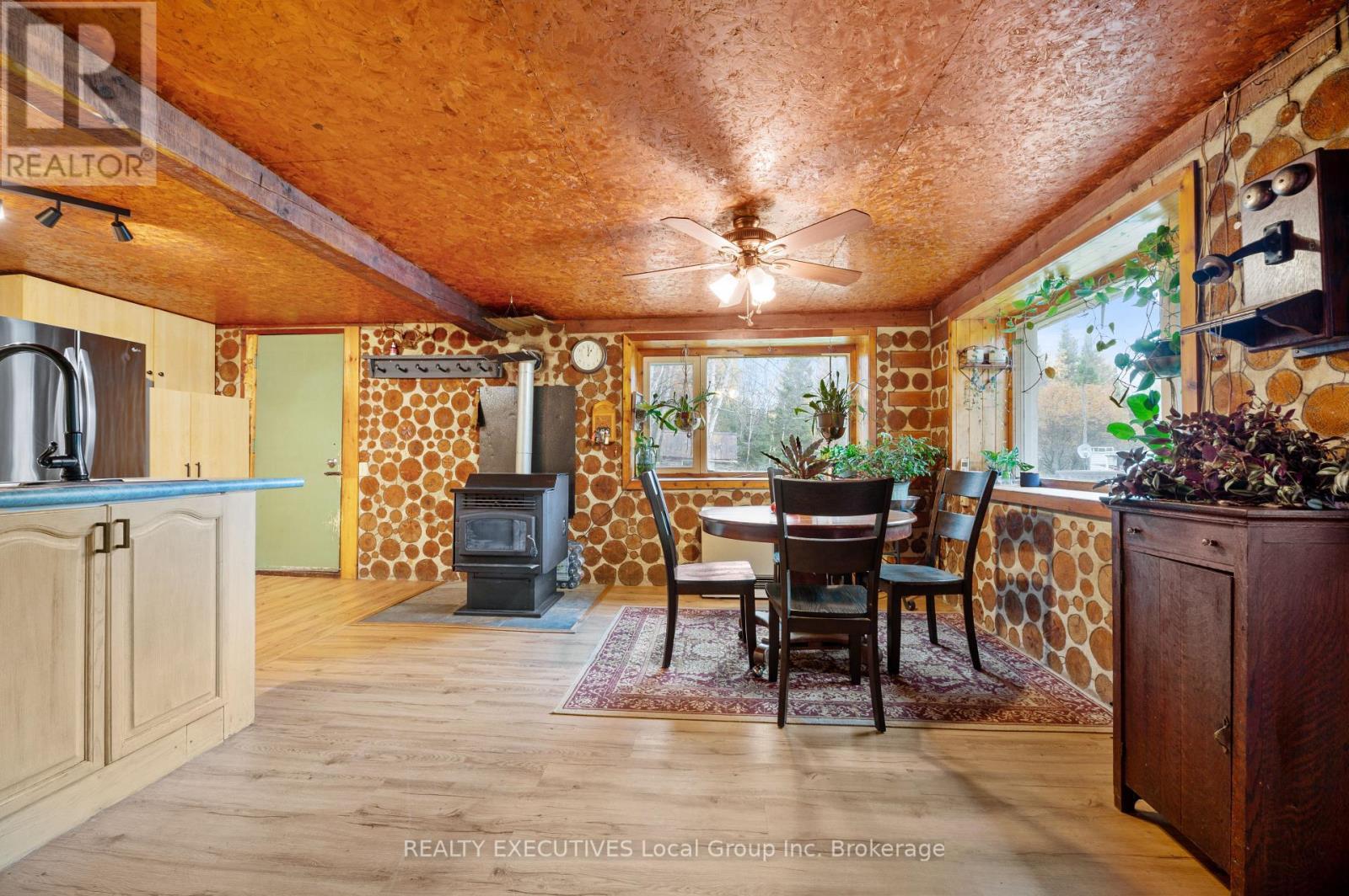 3370 Chiswick Line, Chisholm, ON - Indoor Photo Showing Dining Room With Fireplace