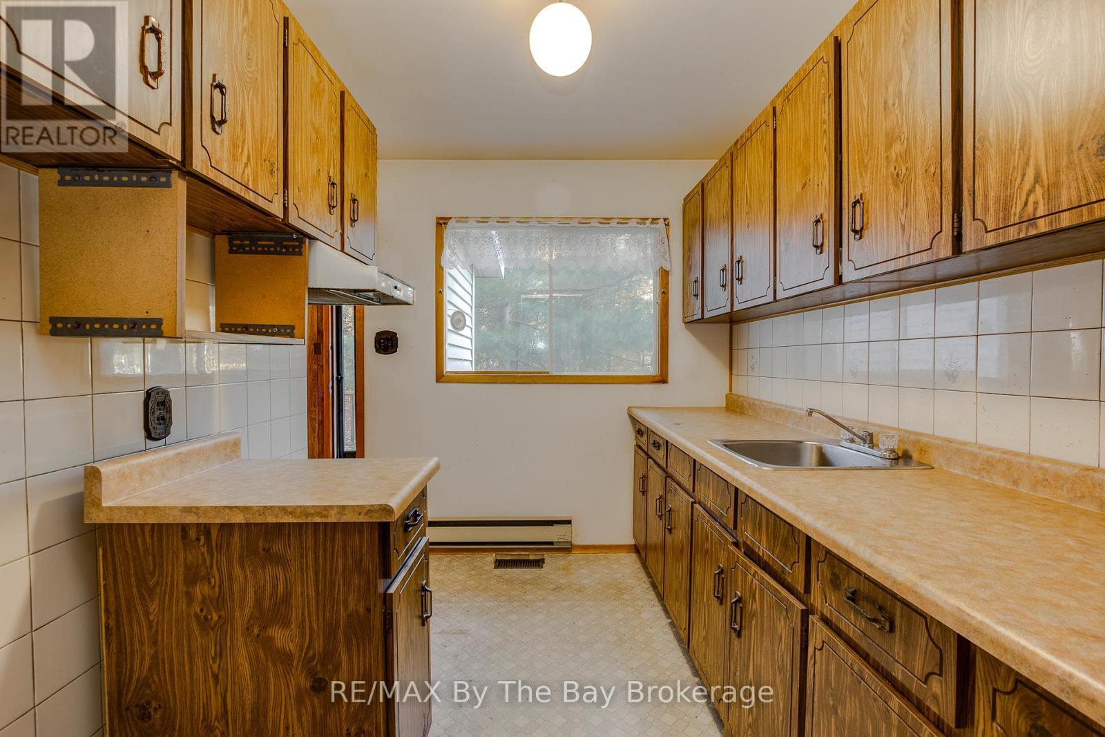 kitchen - 57 Tall Pines Drive, Tiny, ON - Indoor Photo Showing Kitchen