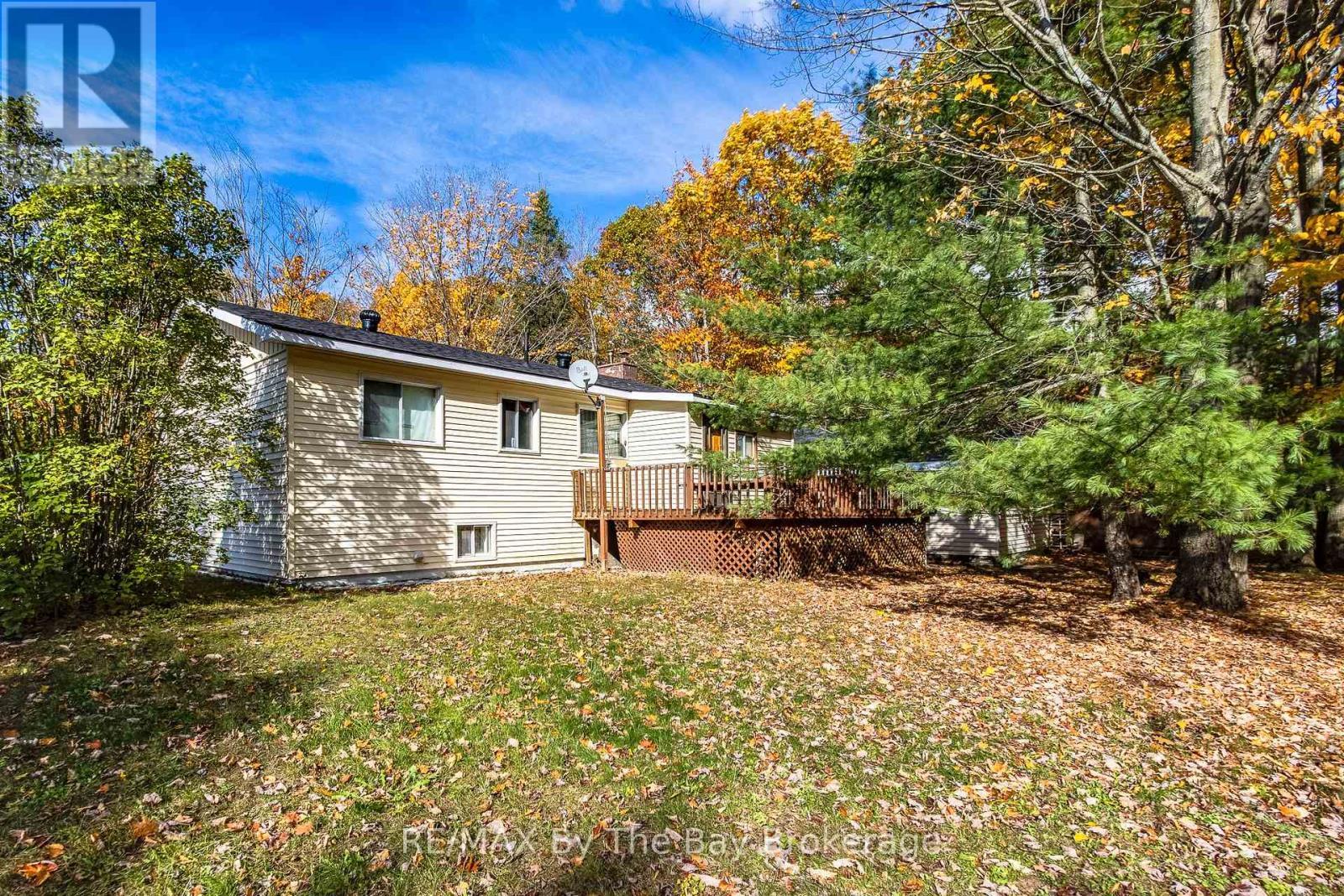 back of house - 57 Tall Pines Drive, Tiny, ON - Outdoor With Deck Patio Veranda