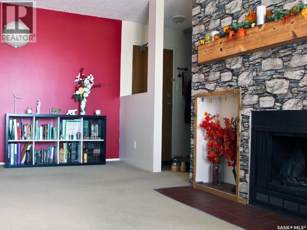 303 51 Rodenbush Drive, Regina, SK - Indoor Photo Showing Other Room With Fireplace