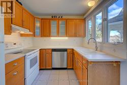 Kitchen with view and access to garden and deck -