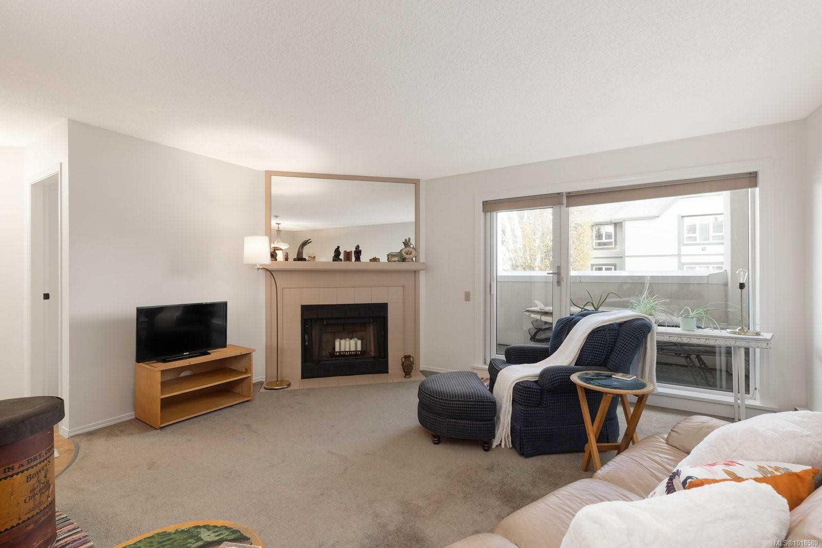 204-2490 Bevan Ave, Sidney, BC - Indoor Photo Showing Living Room With Fireplace