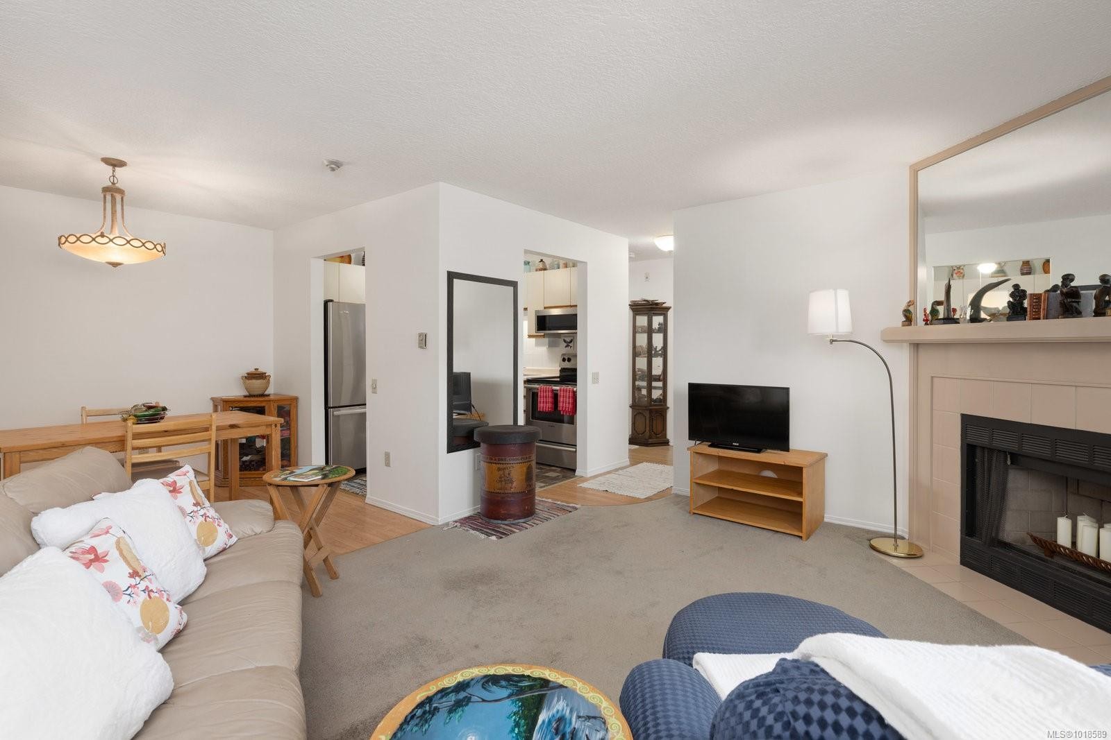 204-2490 Bevan Ave, Sidney, BC - Indoor Photo Showing Living Room With Fireplace