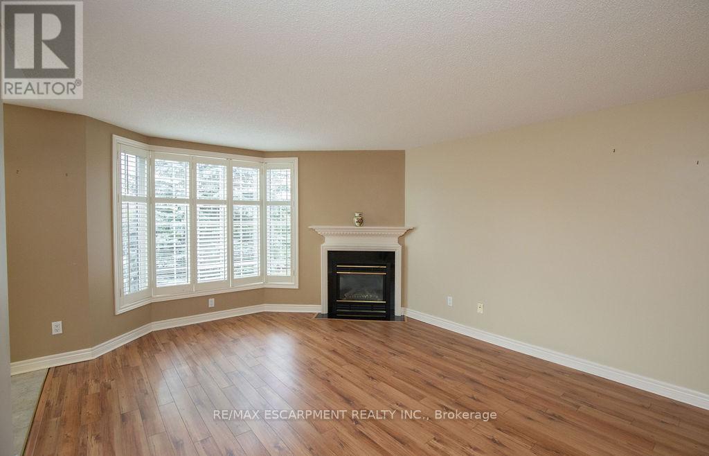 202 - 990 Golf Links Road, Hamilton, ON - Indoor Photo Showing Living Room With Fireplace