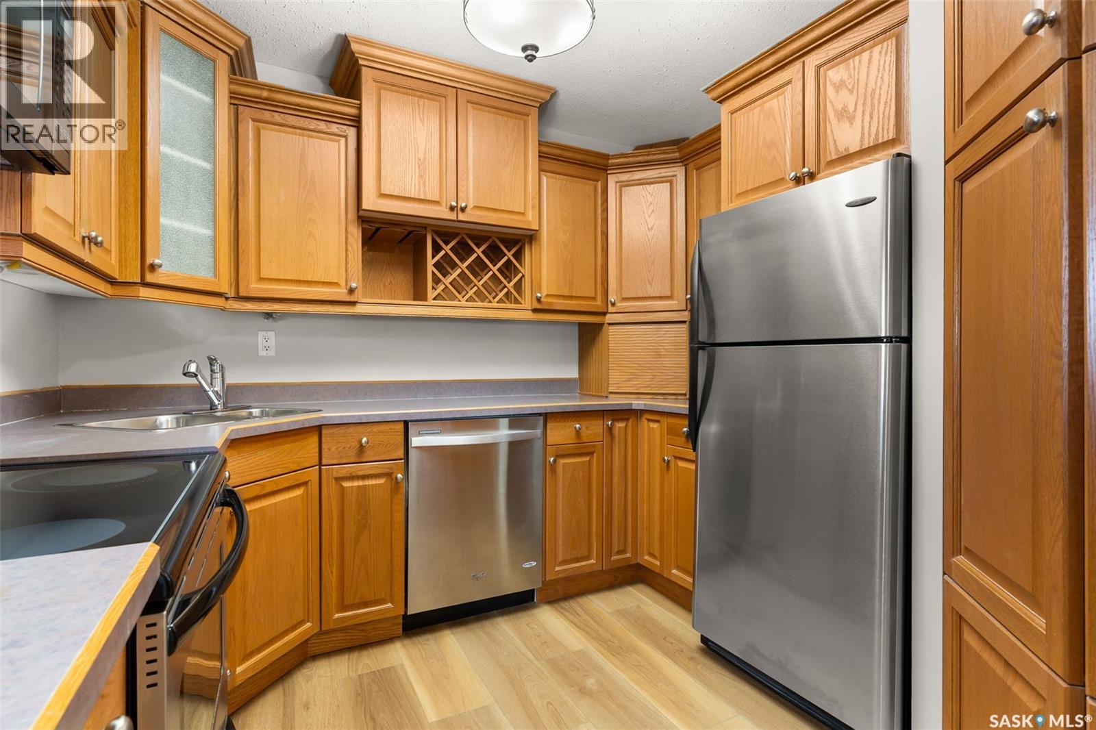 22 4341 Rae Street, Regina, SK - Indoor Photo Showing Kitchen With Stainless Steel Kitchen With Double Sink