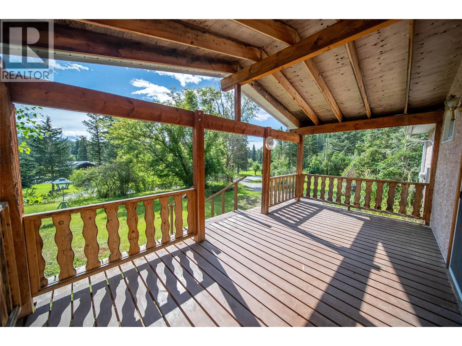 7825 Jaffray Baynes Lake Road Road, Jaffray, BC - Outdoor With Deck Patio Veranda With Exterior