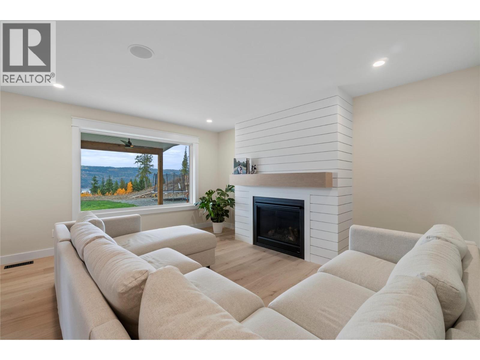 2270 Lions Ridge Road, Celista, BC - Indoor Photo Showing Living Room With Fireplace
