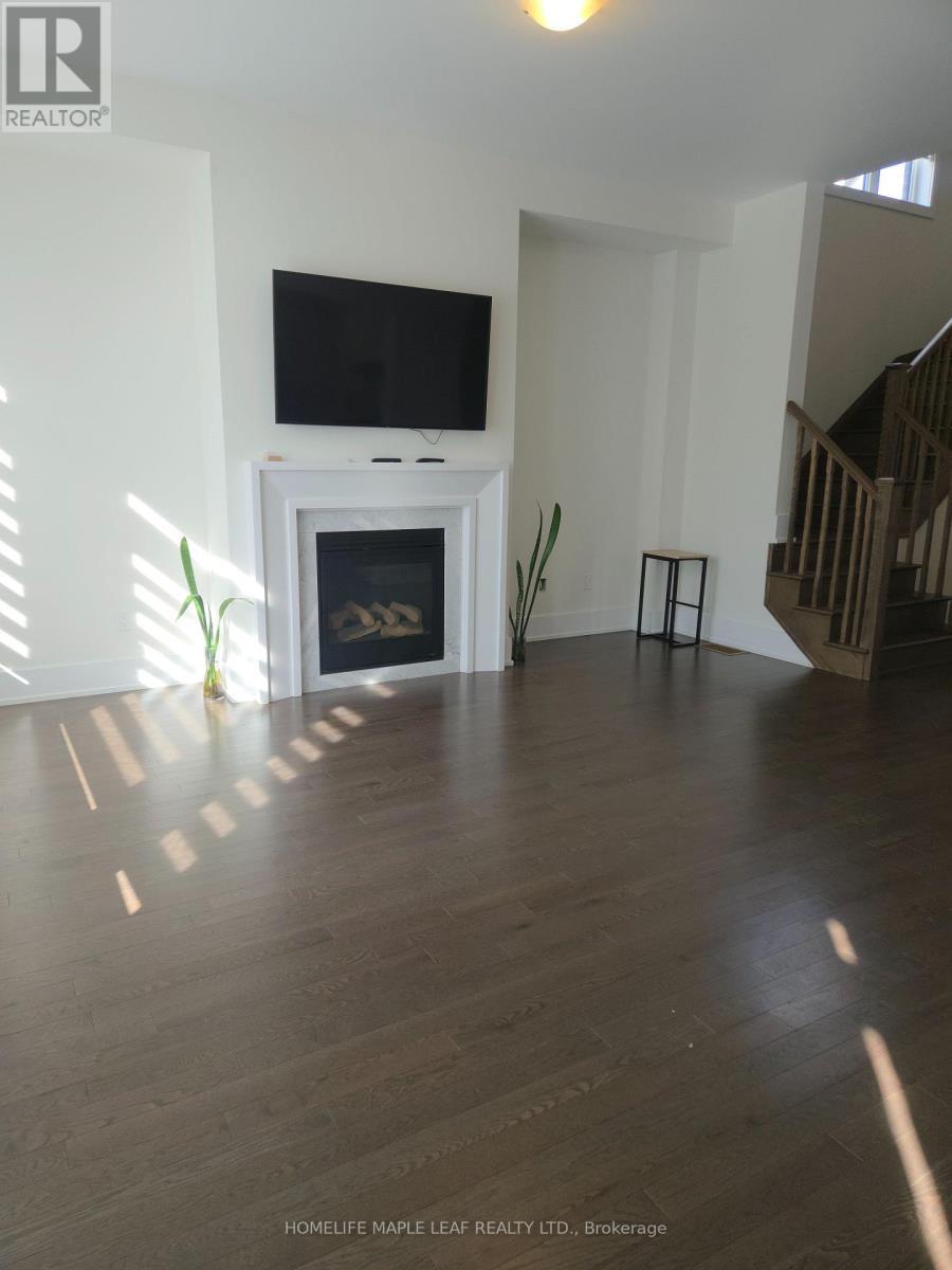 20 Spinland Street, Caledon, ON - Indoor Photo Showing Living Room With Fireplace