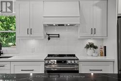 SS Stove, Tile Backsplash & Pot Filler. -