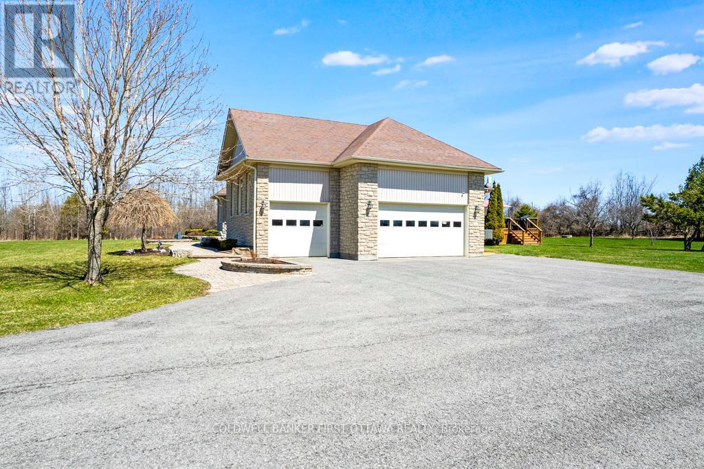 Attached 3-car garage has 2024 propane heater - 556 West Point Drive, Drummond/North Elmsley, ON - Outdoor