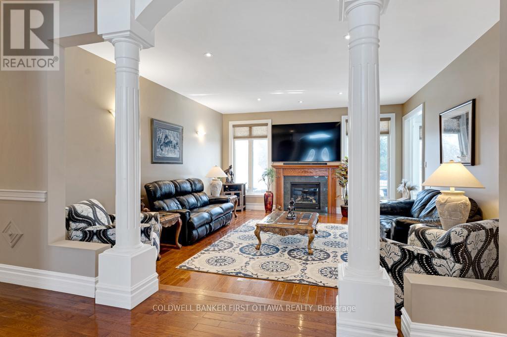 Refined comfort with quality finishes - 556 West Point Drive, Drummond/North Elmsley, ON - Indoor Photo Showing Living Room With Fireplace