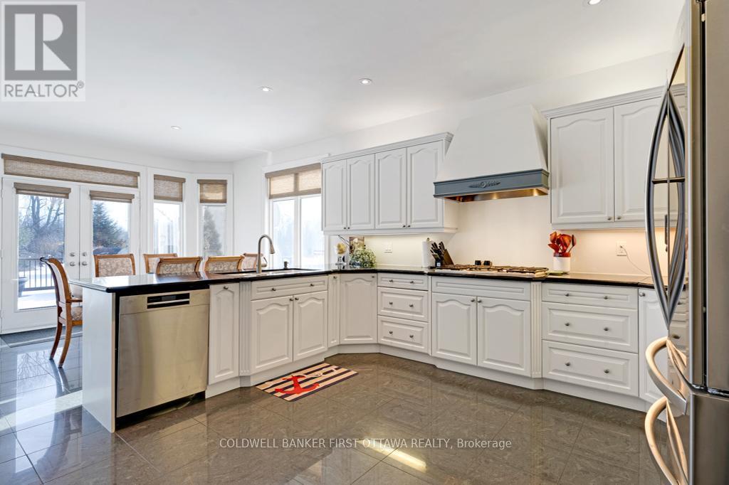 Kitchen open to dinette, with tranquil views - 556 West Point Drive, Drummond/North Elmsley, ON - Indoor Photo Showing Kitchen With Upgraded Kitchen