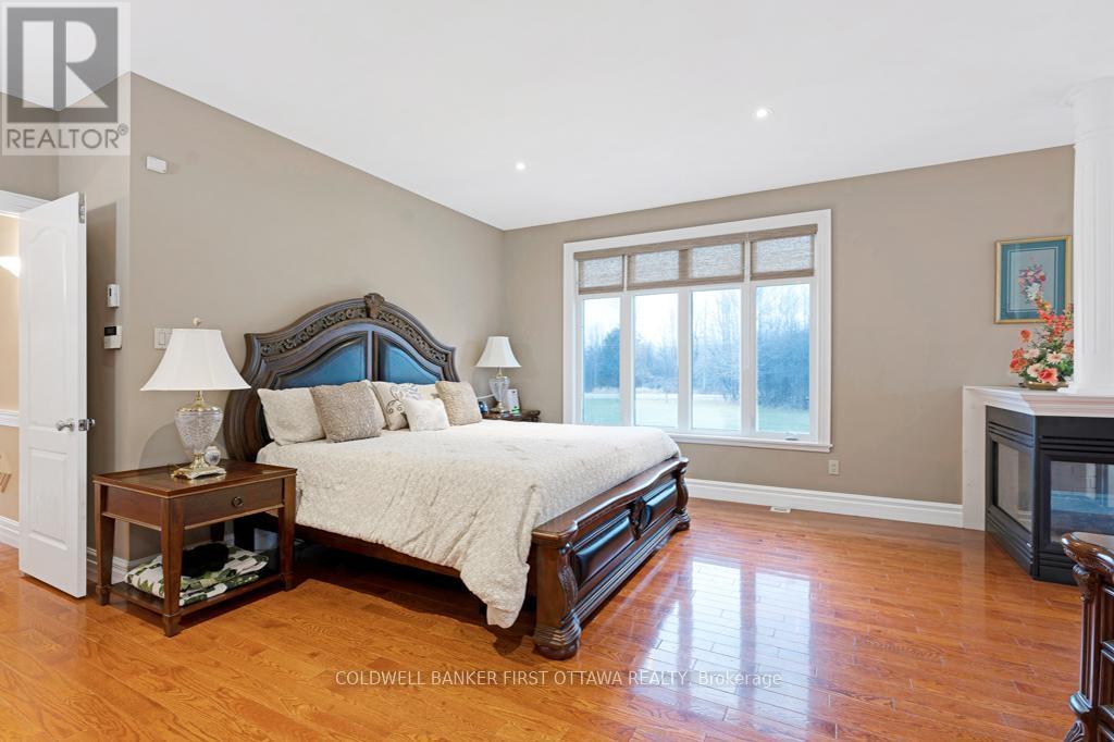 Primary suite flows with natural light - 556 West Point Drive, Drummond/North Elmsley, ON - Indoor Photo Showing Bedroom