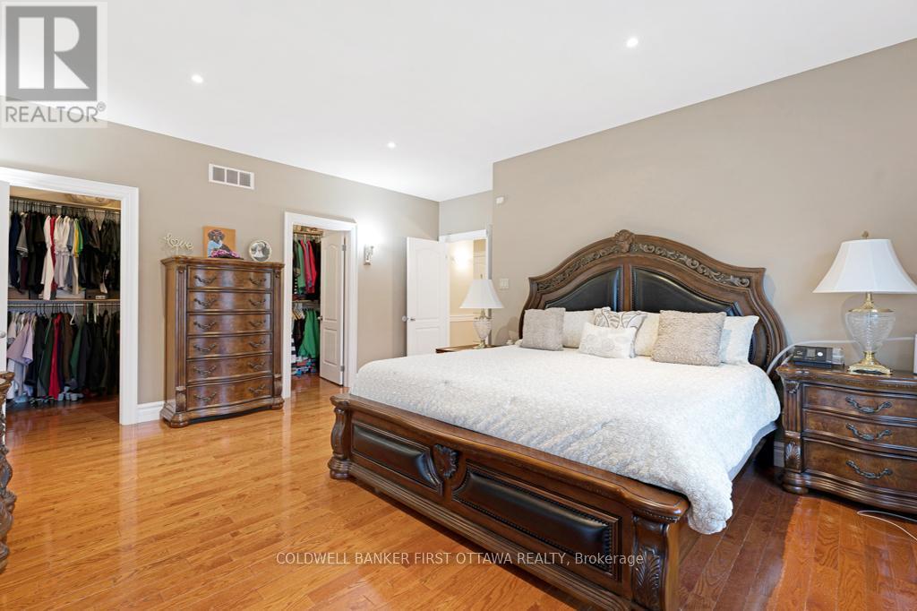 Primary suite two walk-in closets - 556 West Point Drive, Drummond/North Elmsley, ON - Indoor Photo Showing Bedroom