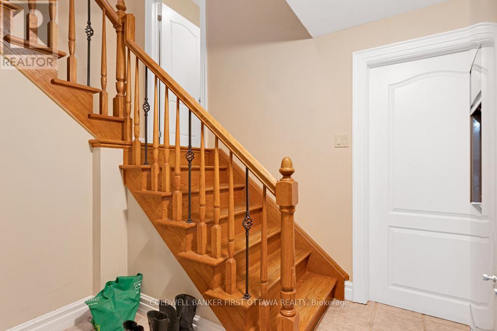 Steps to finished lower level - with heated floors - 556 West Point Drive, Drummond/North Elmsley, ON - Indoor Photo Showing Other Room