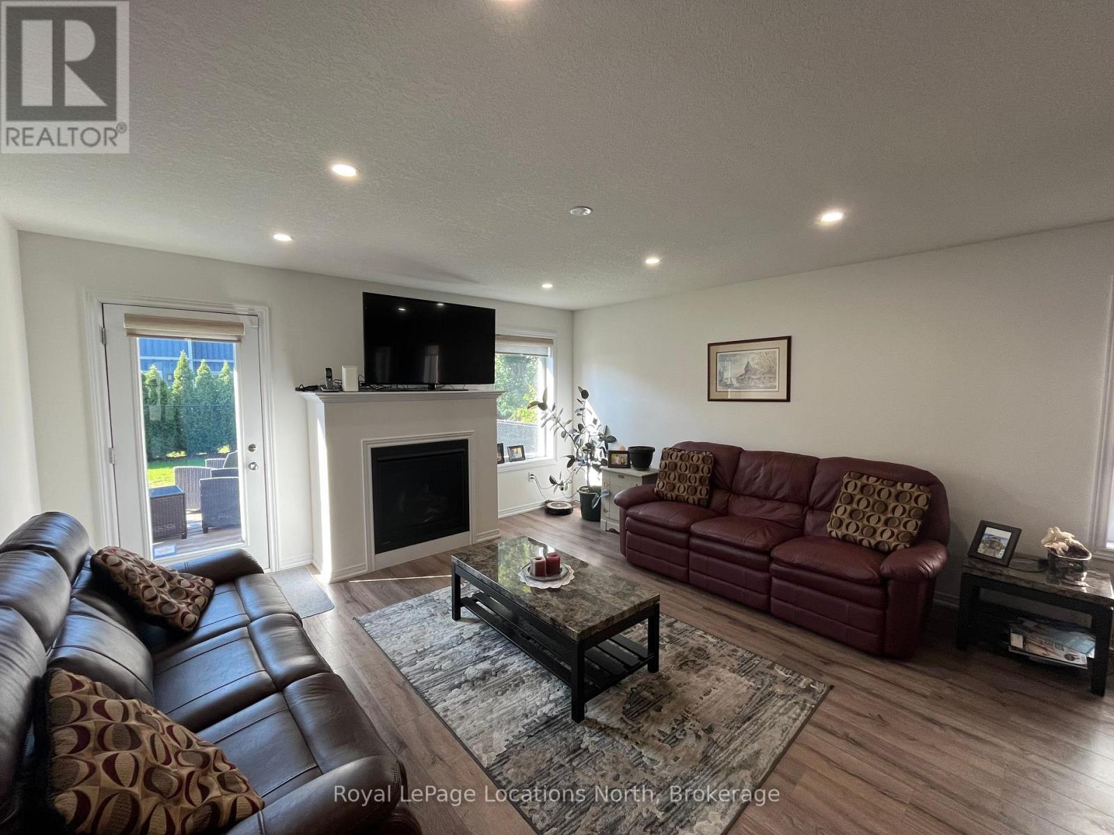 66 Hughes Street, Collingwood, ON - Indoor Photo Showing Living Room With Fireplace