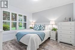 Spacious primary bedroom with large window -