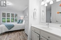 Convenient vanity nook with sink in primary suite -