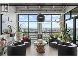 Bright living room with floor to ceiling windows -