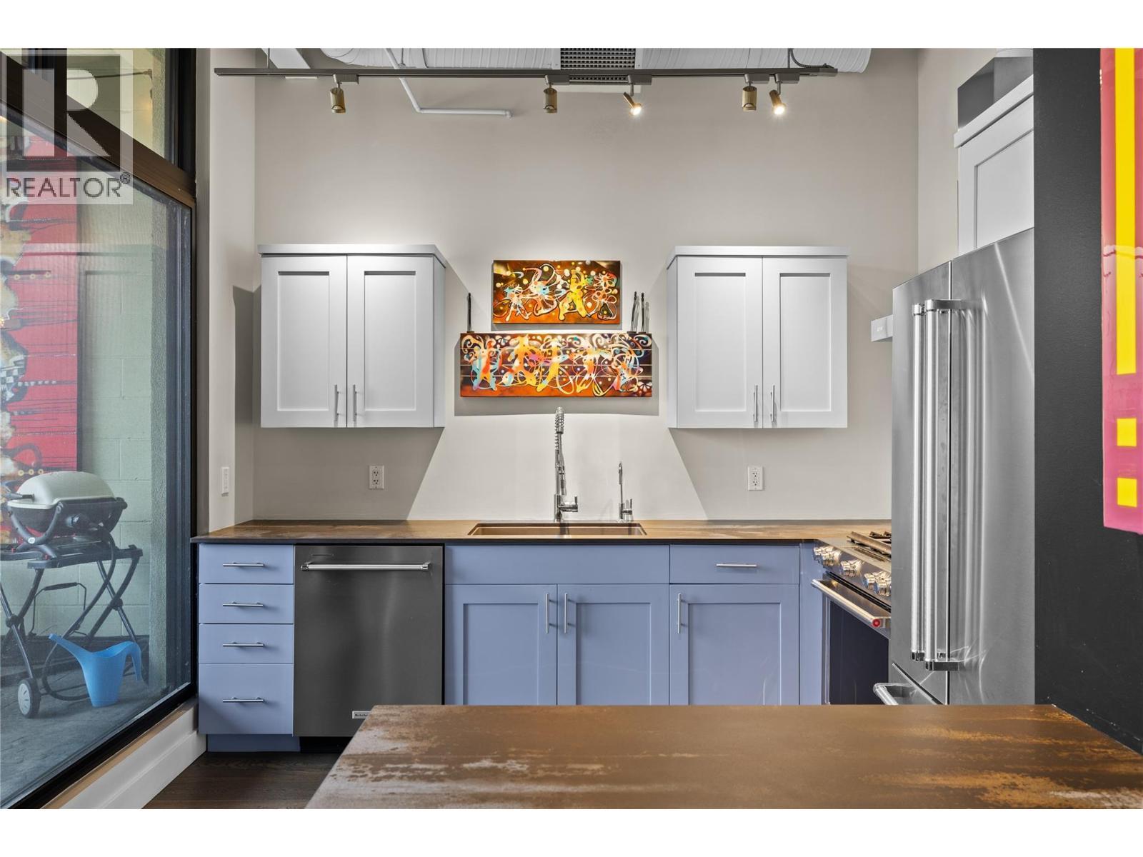 Dekton countertops throughout the kitchen. - 1630 Pandosy Street Unit# 605, Kelowna, BC - Indoor Photo Showing Kitchen