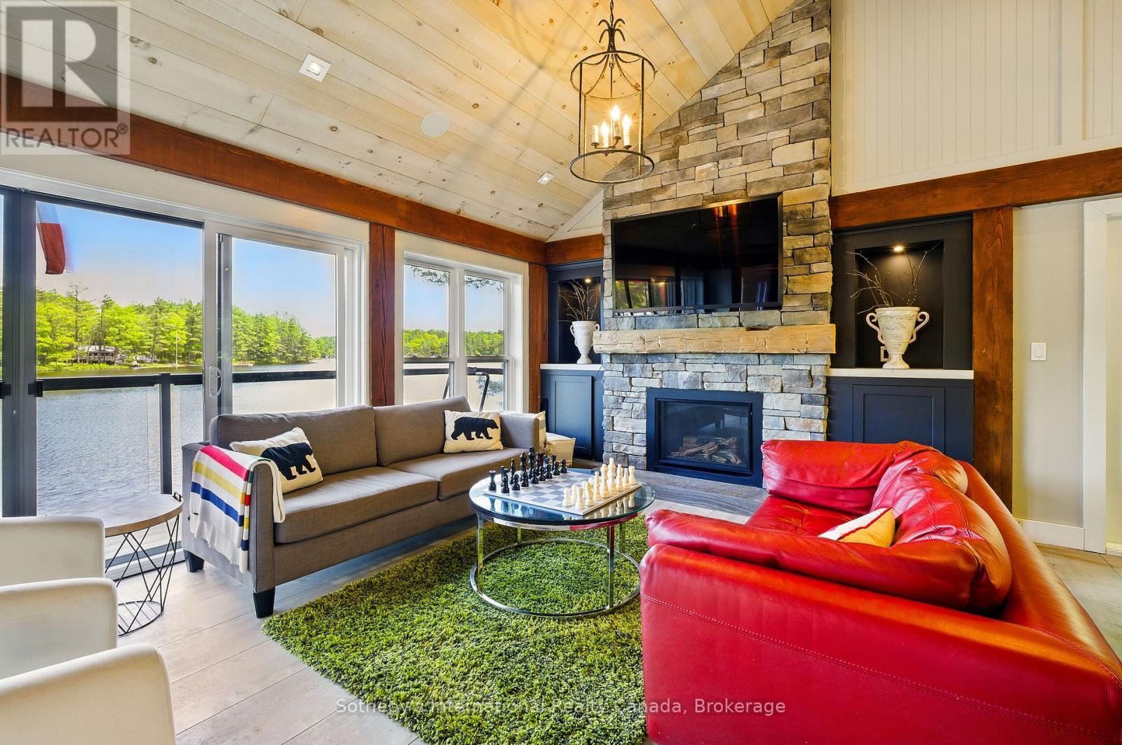 6394 Go Home Lake Shore, Georgian Bay (Gibson), ON - Indoor Photo Showing Living Room With Fireplace