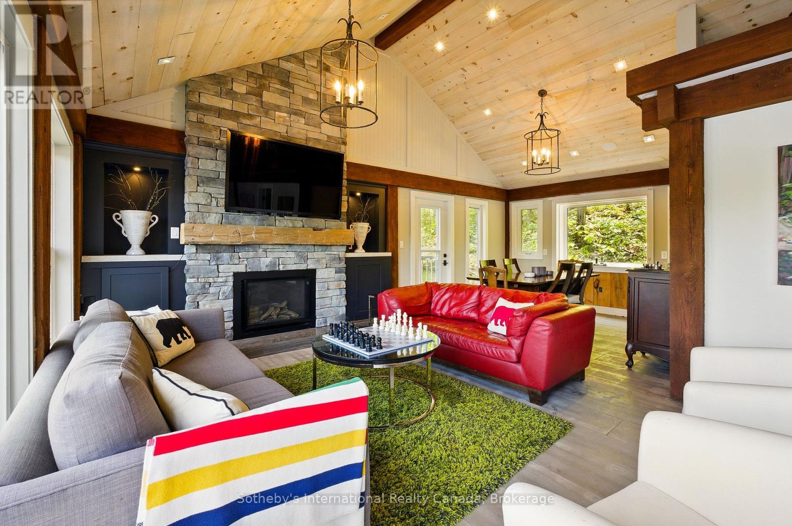 6394 Go Home Lake Shore, Georgian Bay (Gibson), ON - Indoor Photo Showing Living Room With Fireplace