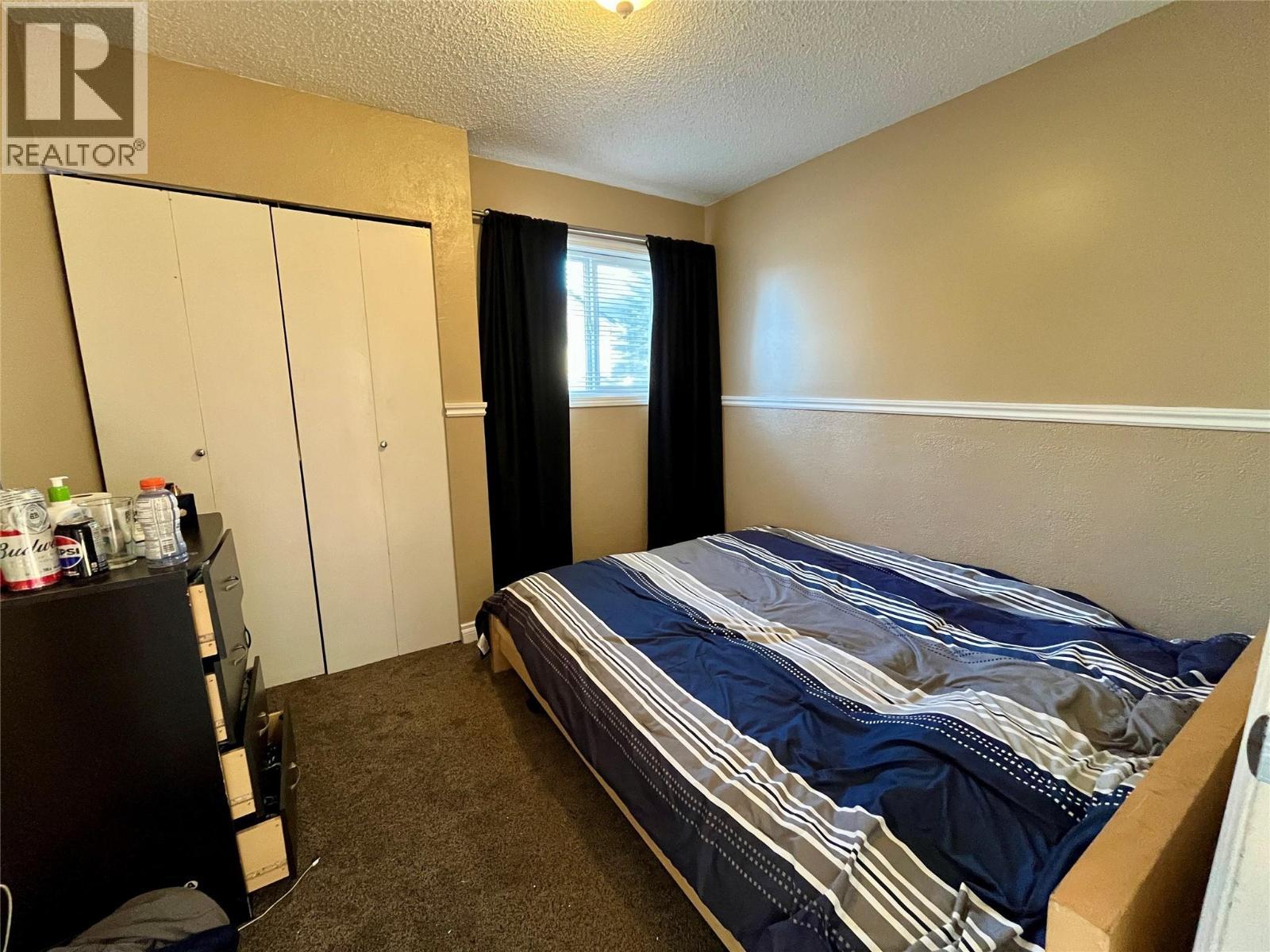 128 Peace River Crescent, Tumbler Ridge, BC - Indoor Photo Showing Bedroom