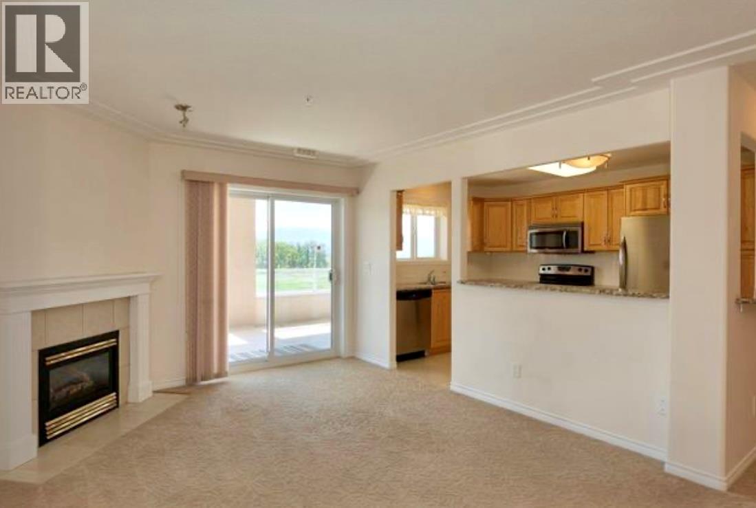 1967 Underhill Street Unit# 604, Kelowna, BC - Indoor With Fireplace