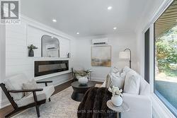 Living Room with Electric Fireplace & Large Window -