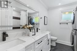 Five Piece Bathroom with Combined Laundry. -