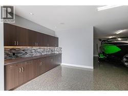 Triple car garage with epoxy floor and built-ins -