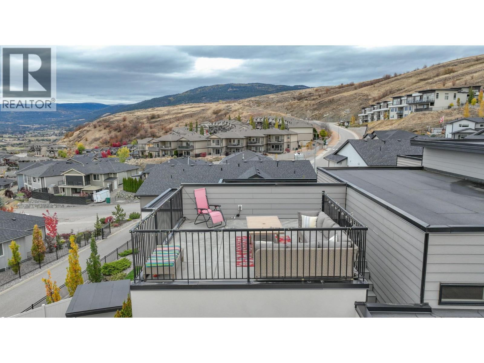 Rooftop patio with fabulous views of the city and valley! - 900 Mt. Ida Drive Unit# 23, Vernon, BC - Outdoor With View