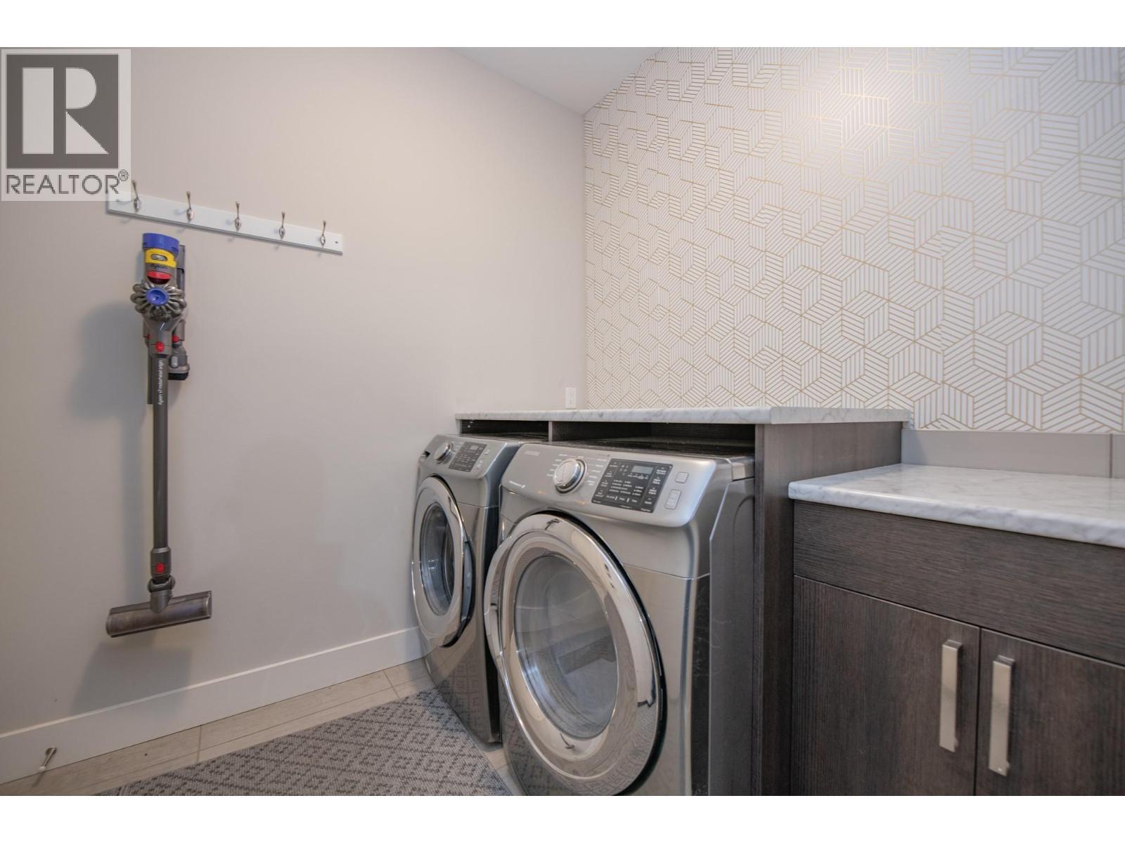 Laundry room off garage entry - 900 Mt. Ida Drive Unit# 23, Vernon, BC - Indoor Photo Showing Laundry Room