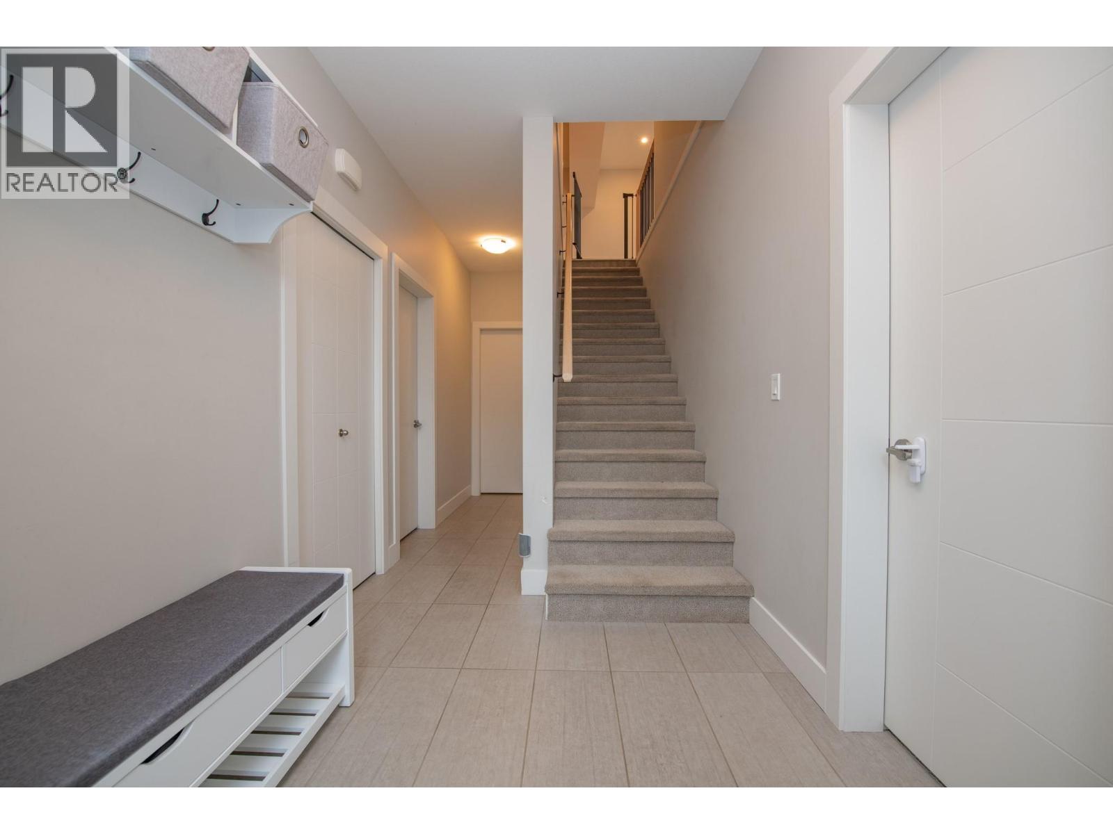 Stairs to main floor - 900 Mt. Ida Drive Unit# 23, Vernon, BC - Indoor Photo Showing Other Room