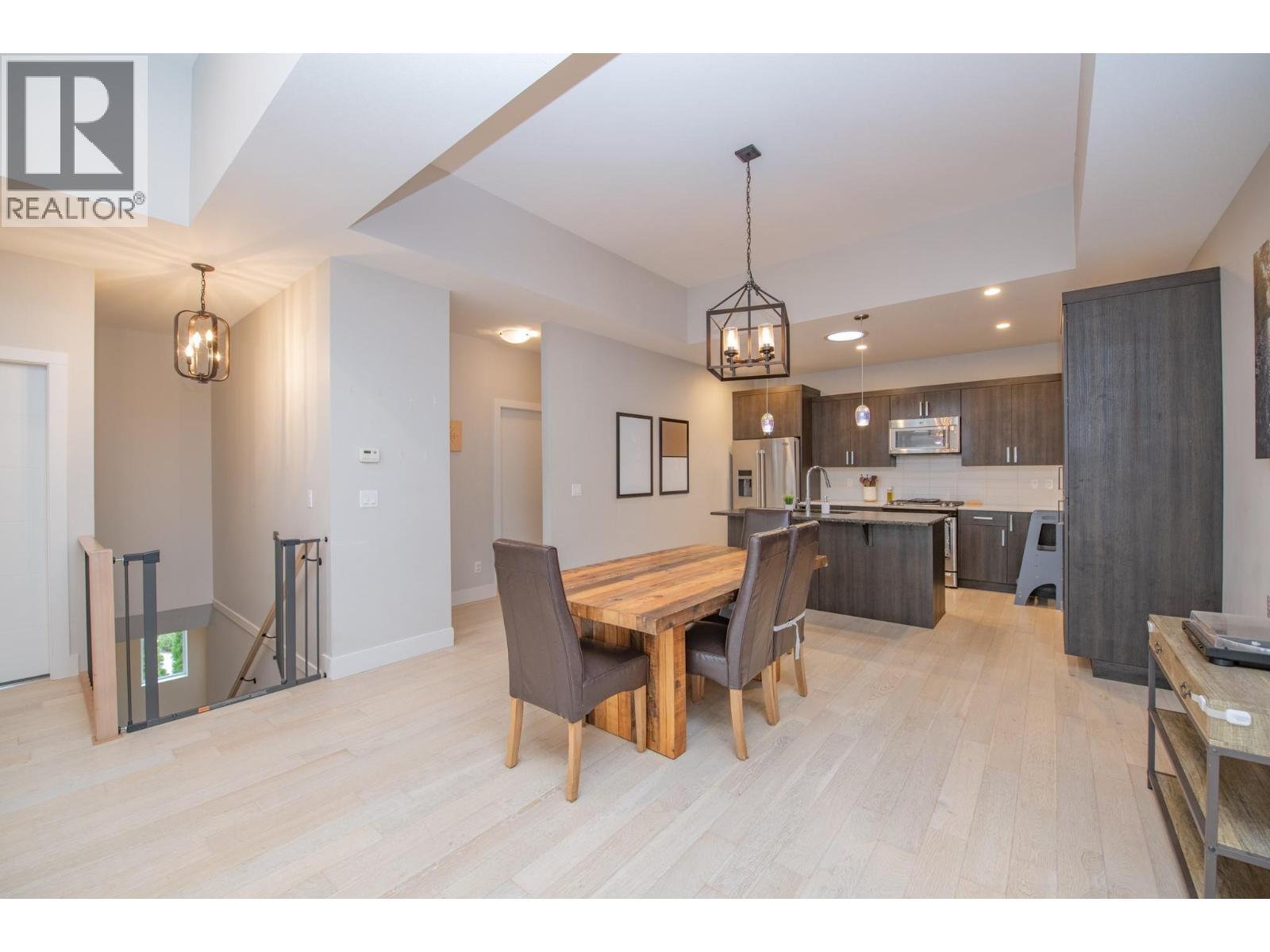 Open floor plan on main - 900 Mt. Ida Drive Unit# 23, Vernon, BC - Indoor Photo Showing Dining Room