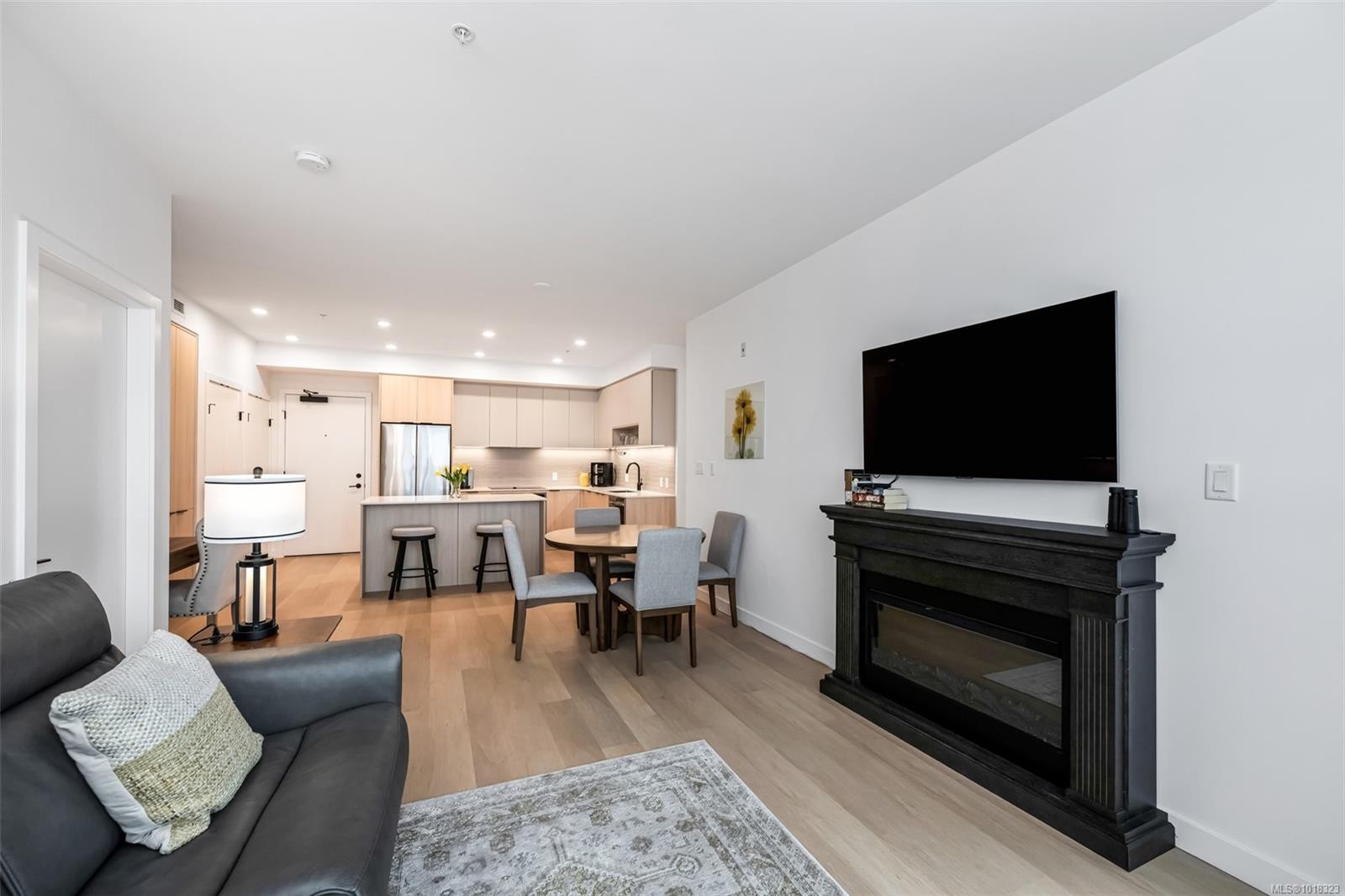 411-3564A Ryder Hesjedal Way, Colwood, BC - Indoor Photo Showing Living Room With Fireplace