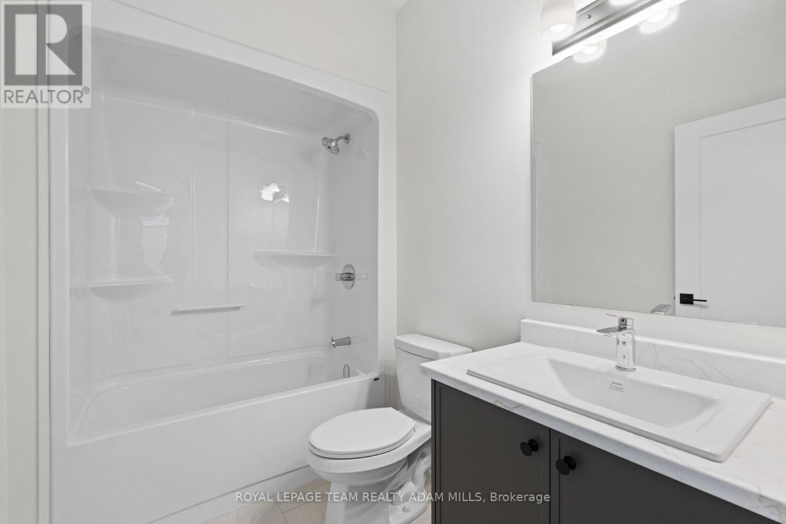 Main Full Bath. Finishes may vary - 2 - 1104 A Moore Street, Brockville, ON - Indoor Photo Showing Bathroom