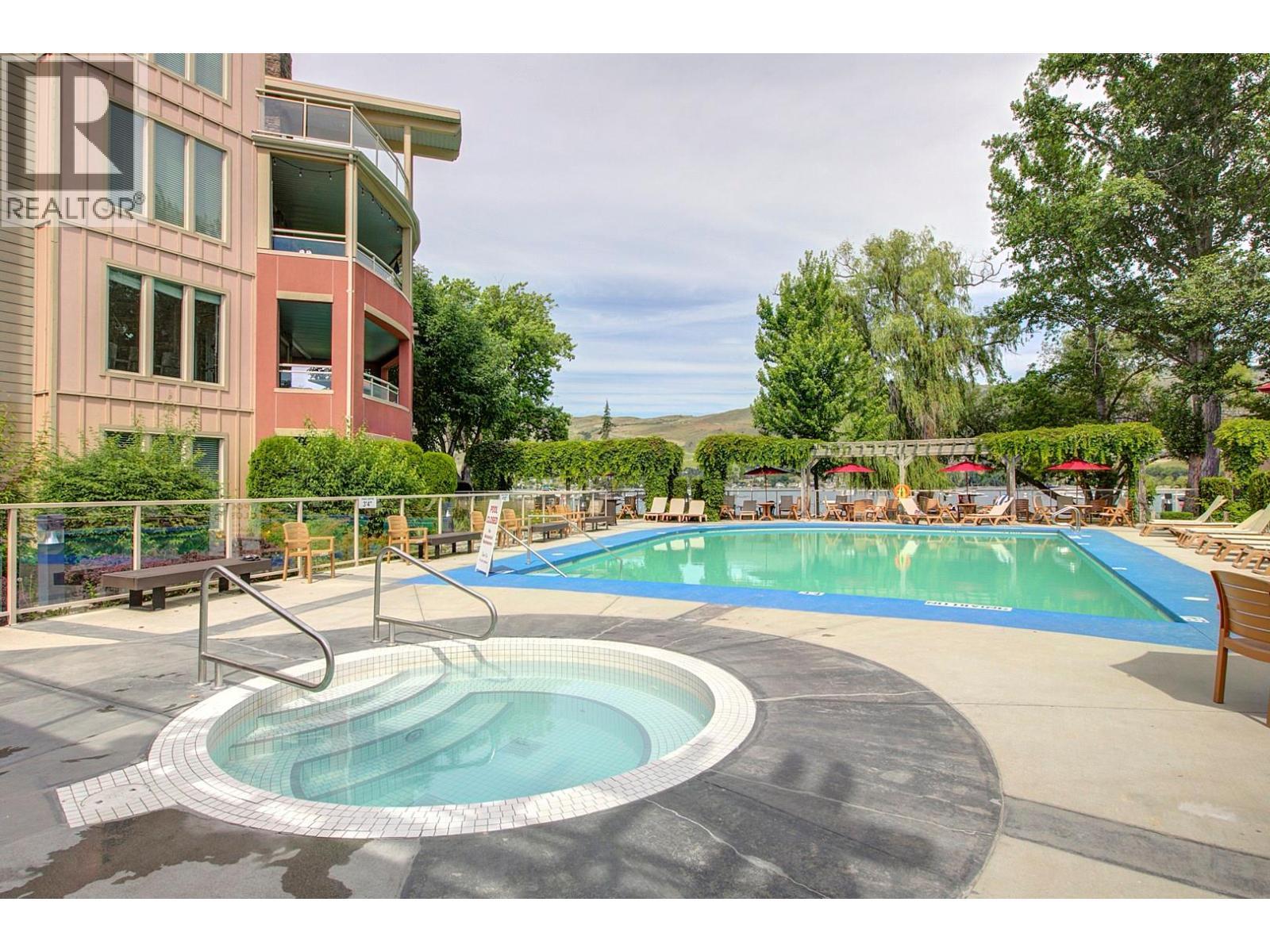 7343 Okanagan Landing Road Unit# 1114, Vernon, BC - Outdoor With In Ground Pool With Backyard