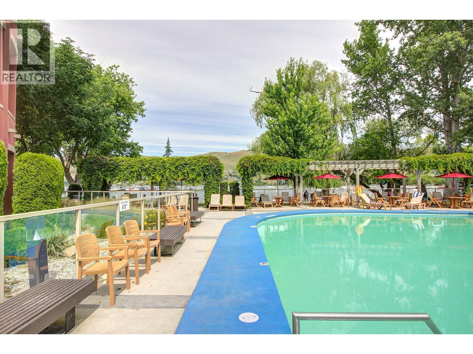 7343 Okanagan Landing Road Unit# 1114, Vernon, BC - Outdoor With In Ground Pool With Backyard