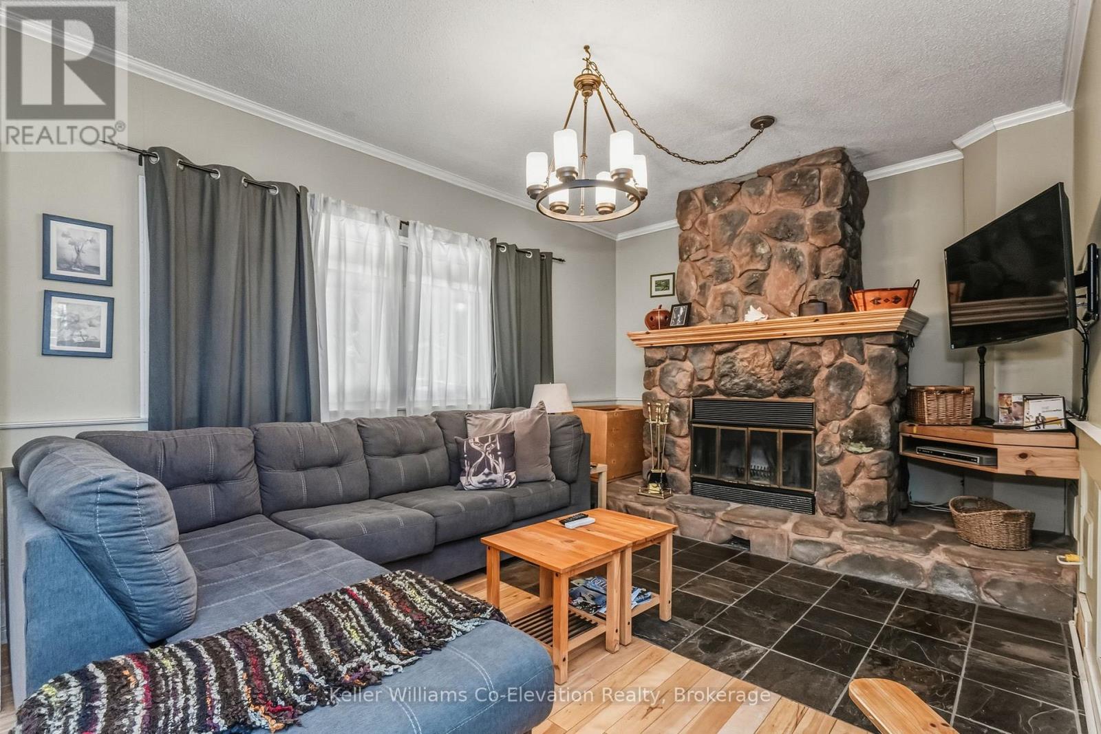 19 Huron Trail, Georgian Bay (Baxter), ON - Indoor Photo Showing Living Room With Fireplace