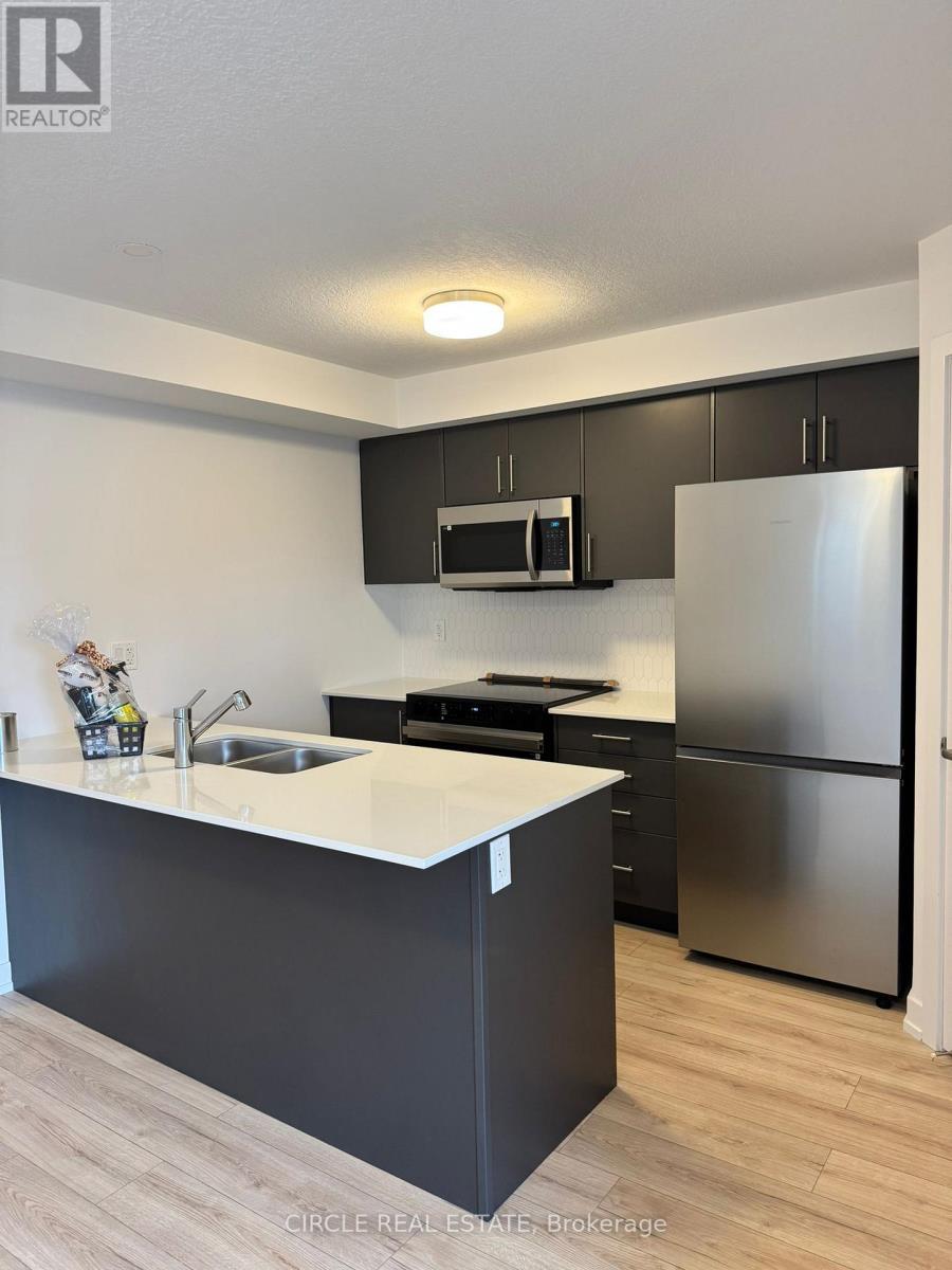 69 - 940 St David Street N, Centre Wellington, ON - Indoor Photo Showing Kitchen With Double Sink