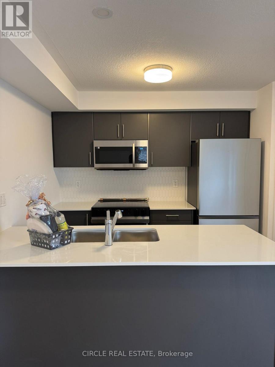 69 - 940 St David Street N, Centre Wellington, ON - Indoor Photo Showing Kitchen With Double Sink