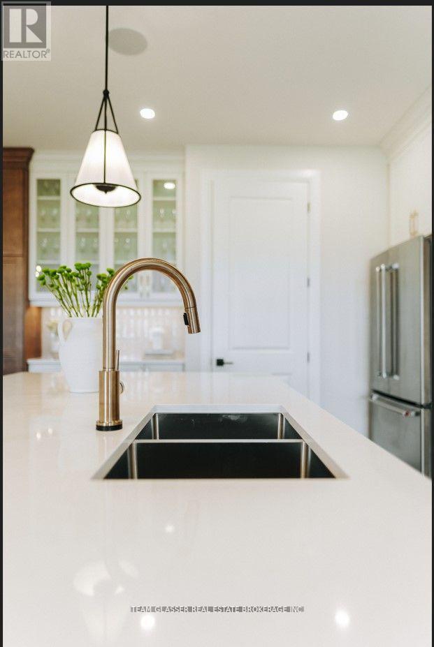 22 Dearing Drive, South Huron (Stephen), ON - Indoor Photo Showing Kitchen With Double Sink