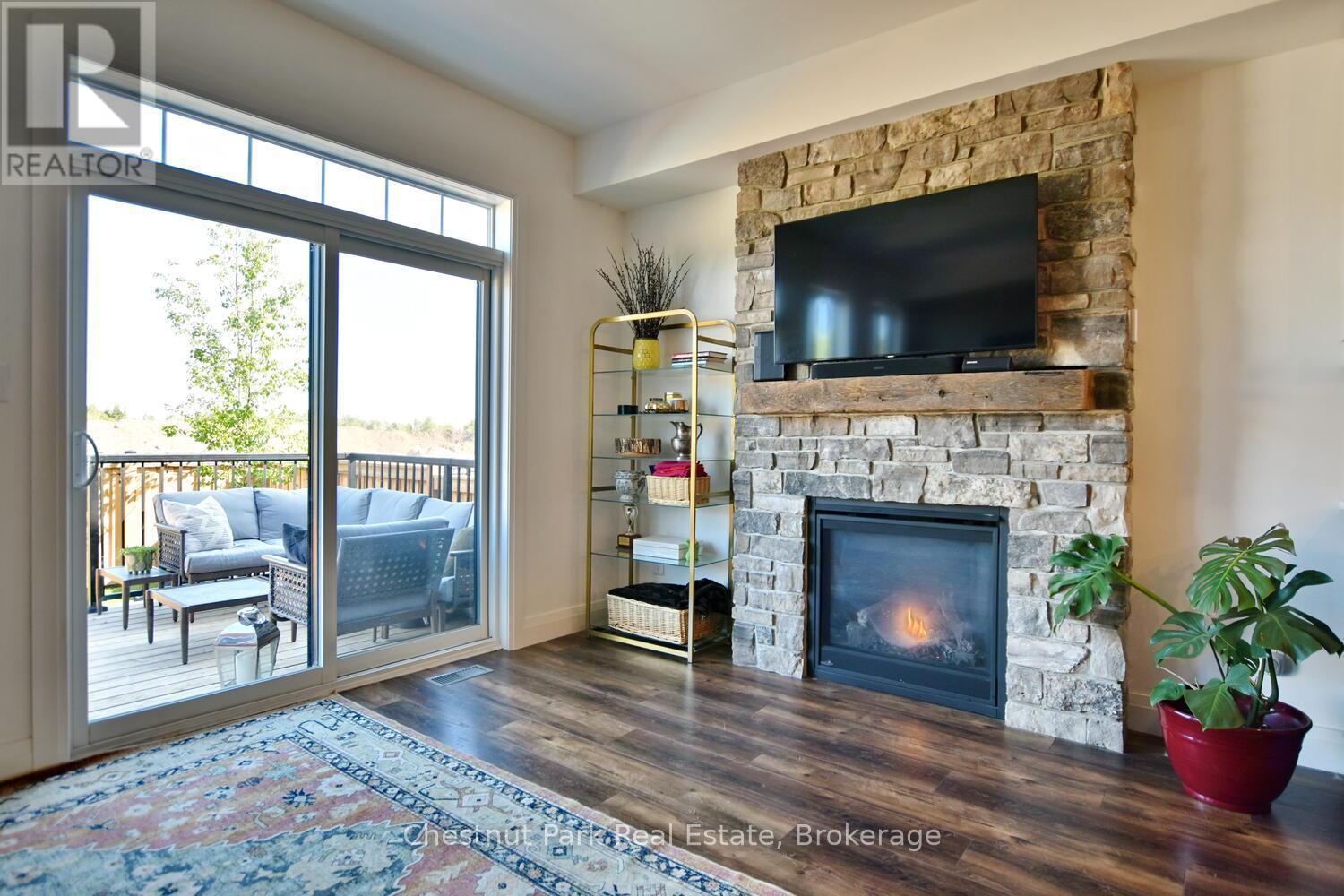 146 Red Pine Street, Blue Mountains, ON - Indoor Photo Showing Living Room With Fireplace