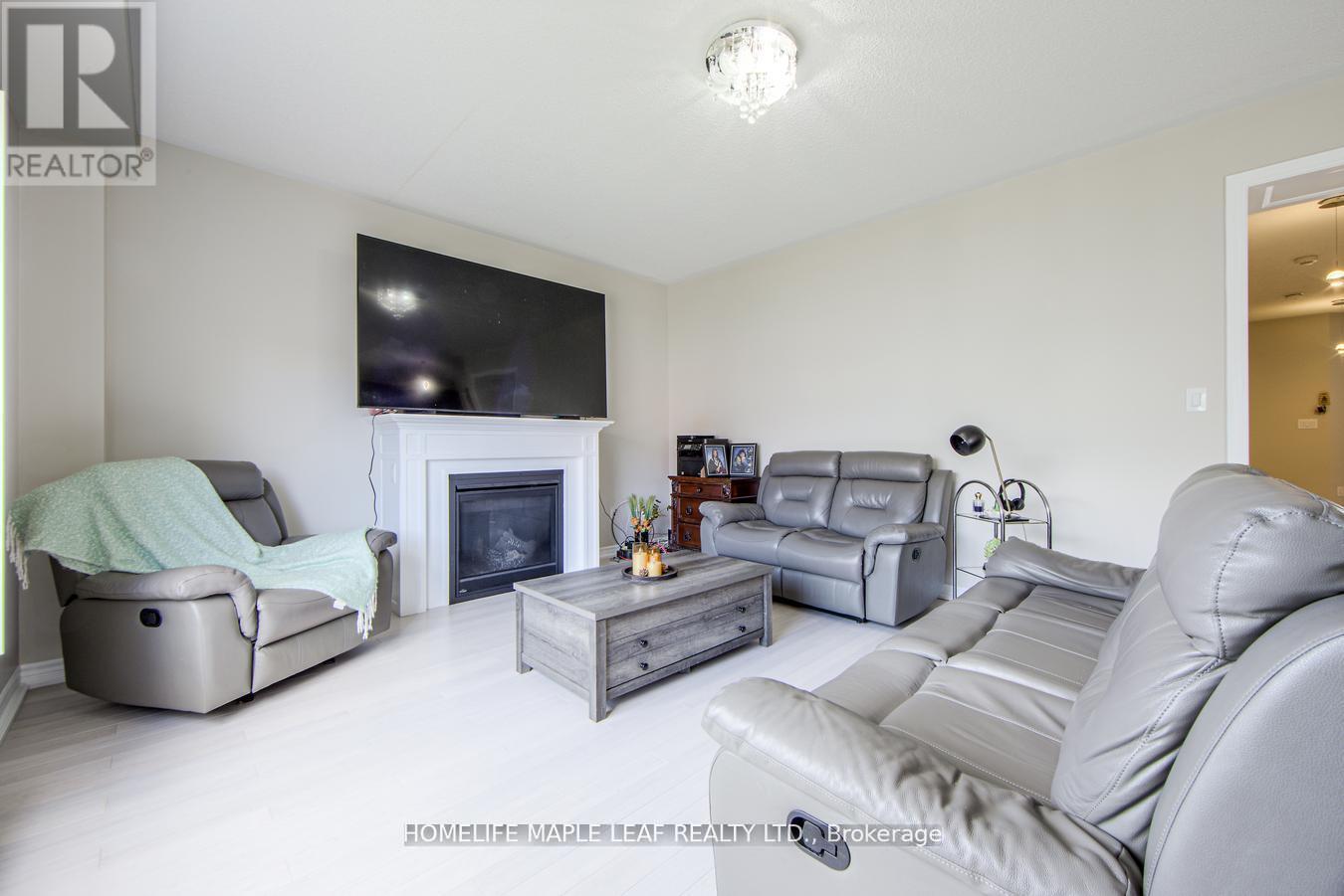 535 Wansbrough Way, Shelburne, ON - Indoor Photo Showing Living Room With Fireplace