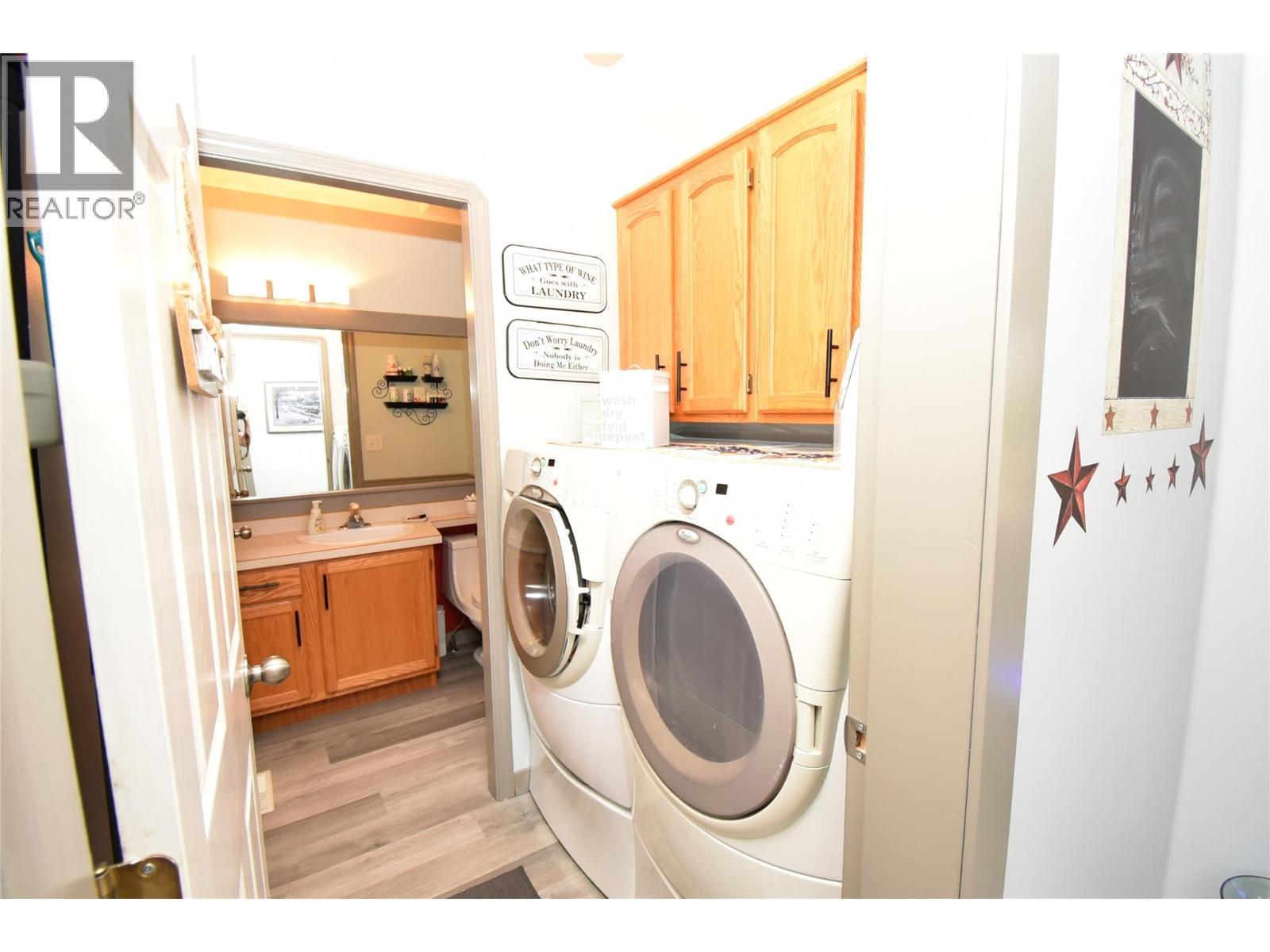 Laundry room just off the hallway - 4404 20 Street Unit# 3, Vernon, BC - Indoor Photo Showing Laundry Room