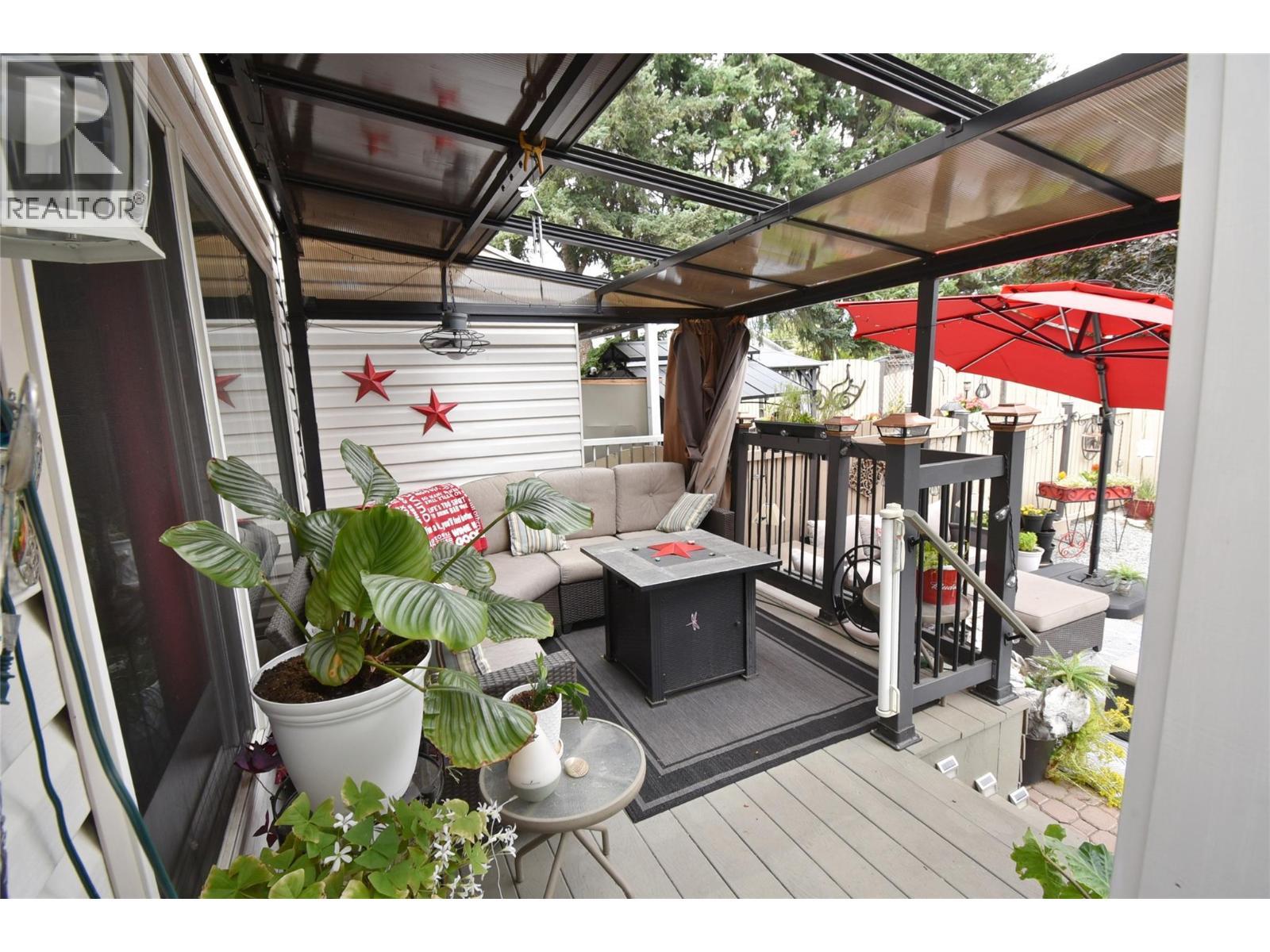 Back covered deck accessed from dining room - 4404 20 Street Unit# 3, Vernon, BC - Outdoor With Deck Patio Veranda With Exterior