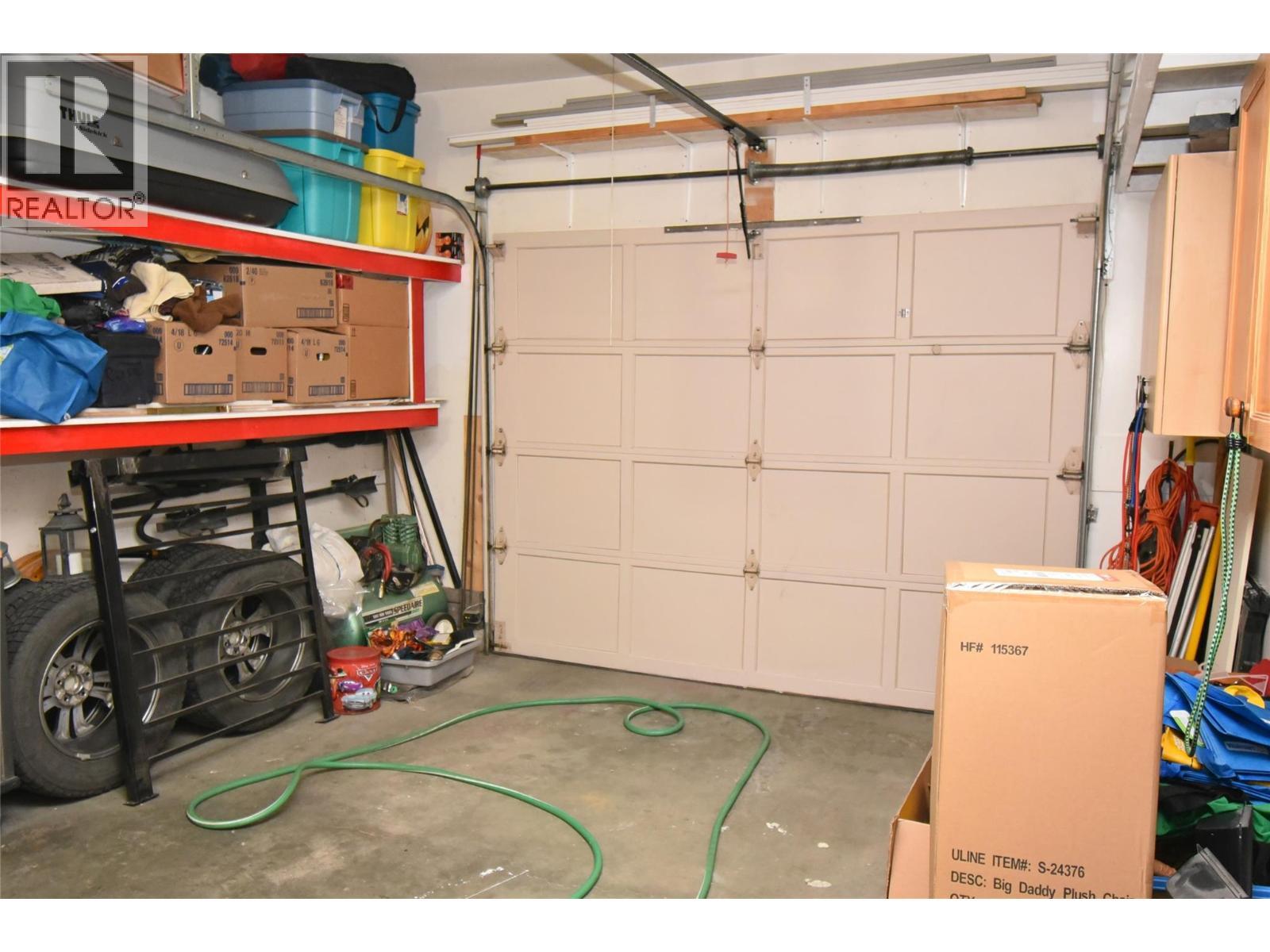 Single garage off of foyer on main level - 4404 20 Street Unit# 3, Vernon, BC - Indoor Photo Showing Garage